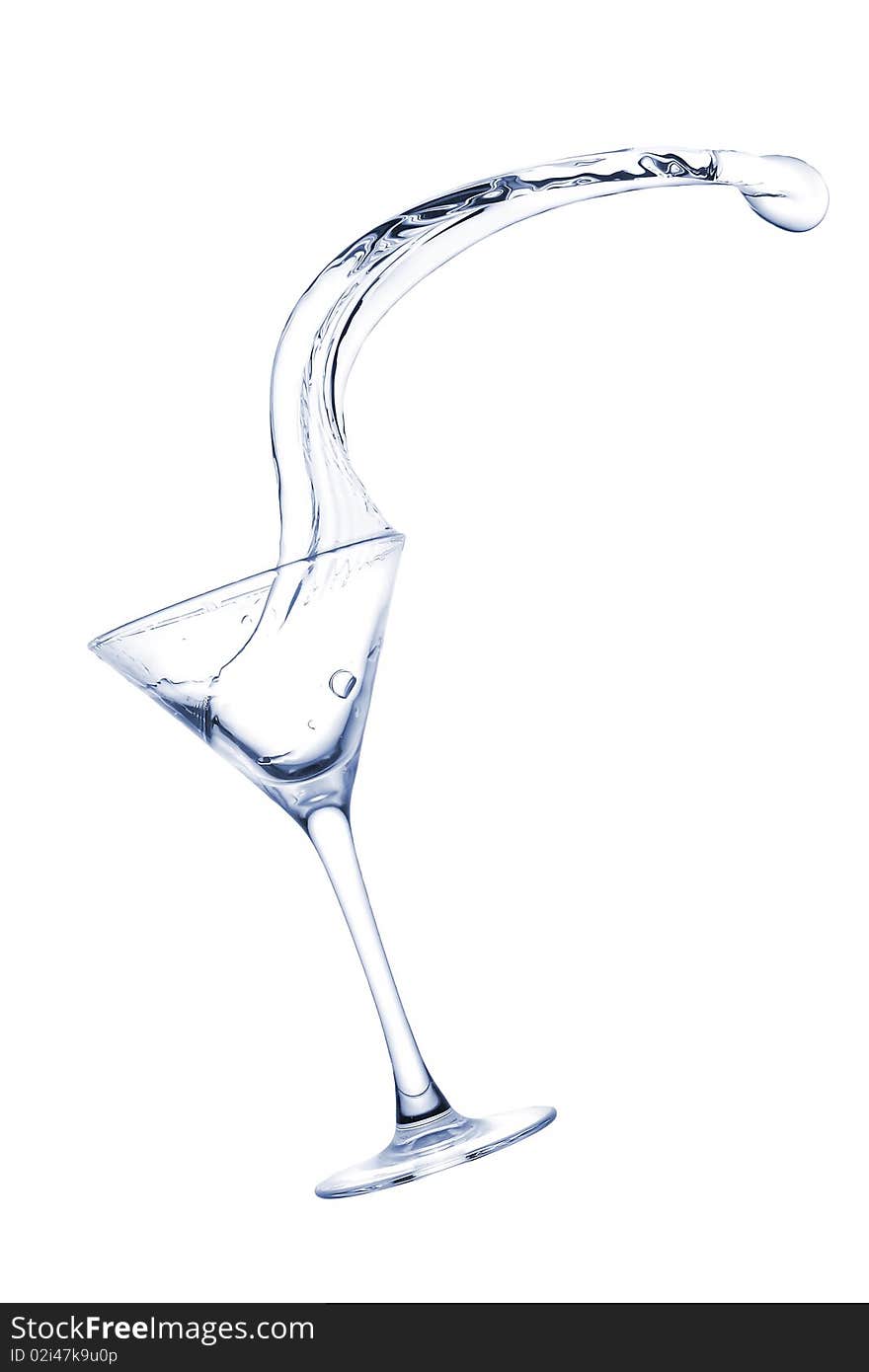 Freakish splashes transparent at its finest from a glass for martini close up.