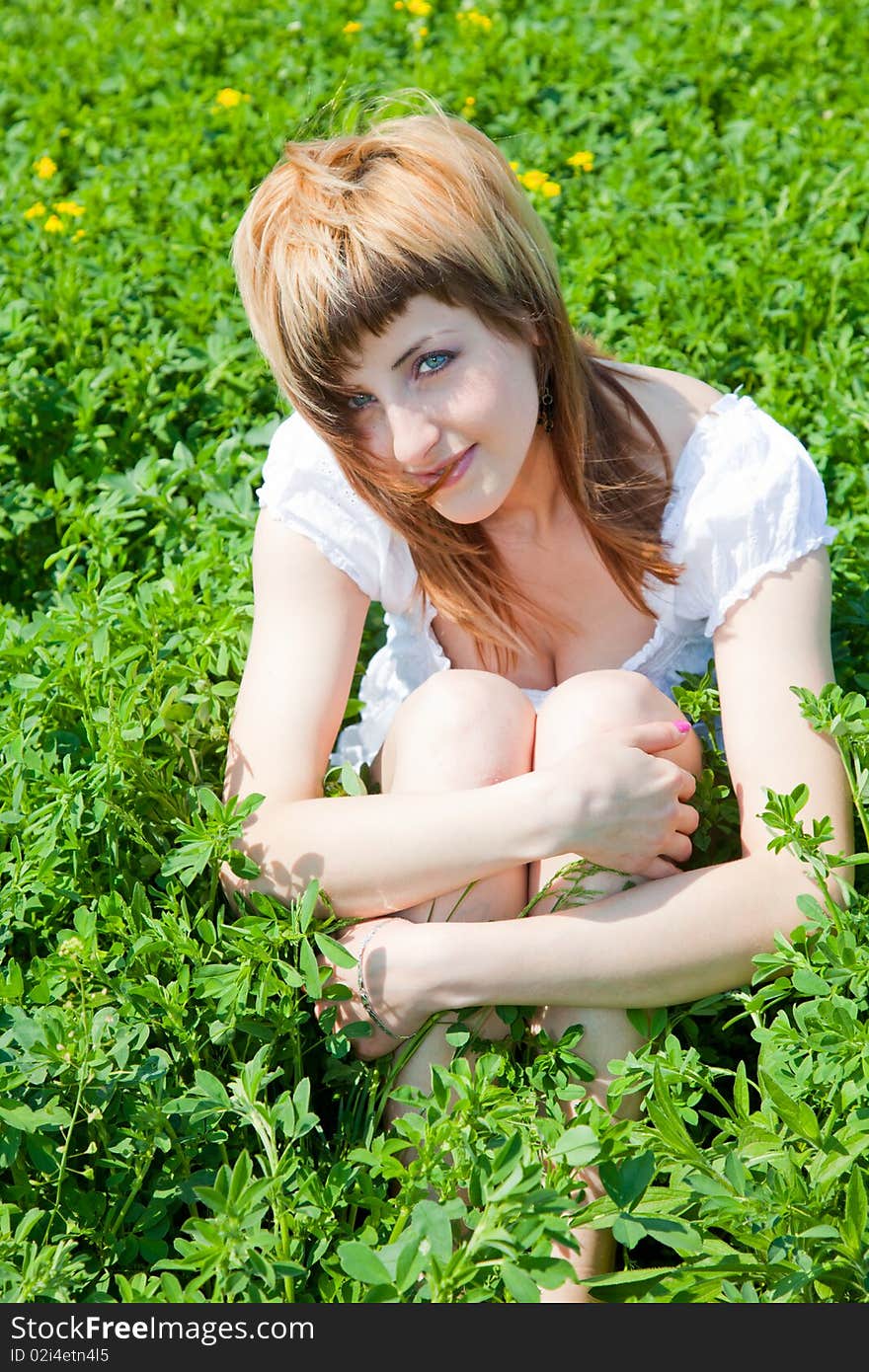 Beautiful young woman enjoying a sunny day of spring in the nature. Beautiful young woman enjoying a sunny day of spring in the nature