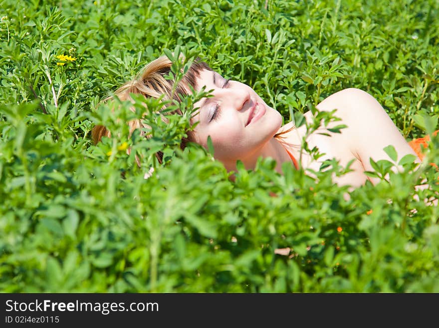 Beautiful young woman enjoying a sunny day of spring in the nature. Beautiful young woman enjoying a sunny day of spring in the nature