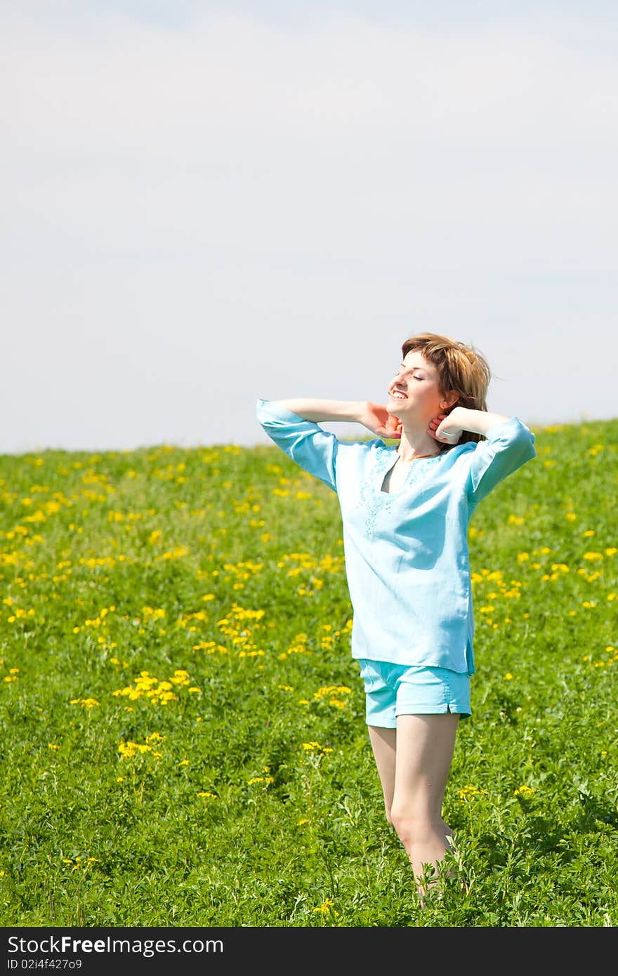 Beautiful young woman enjoying a sunny day of spring in the nature. Beautiful young woman enjoying a sunny day of spring in the nature