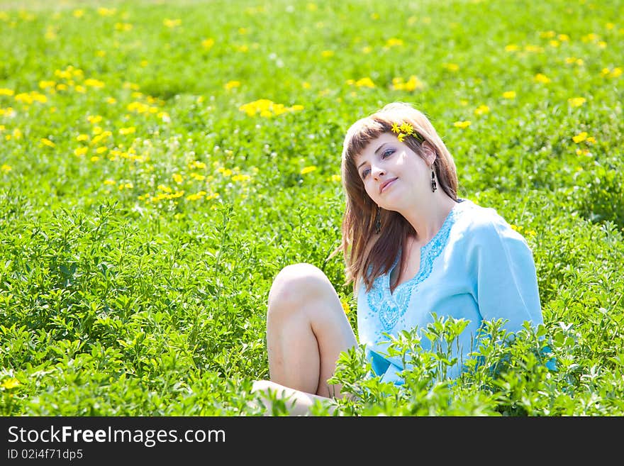 Beautiful young woman enjoying a sunny day of spring in the nature. Beautiful young woman enjoying a sunny day of spring in the nature