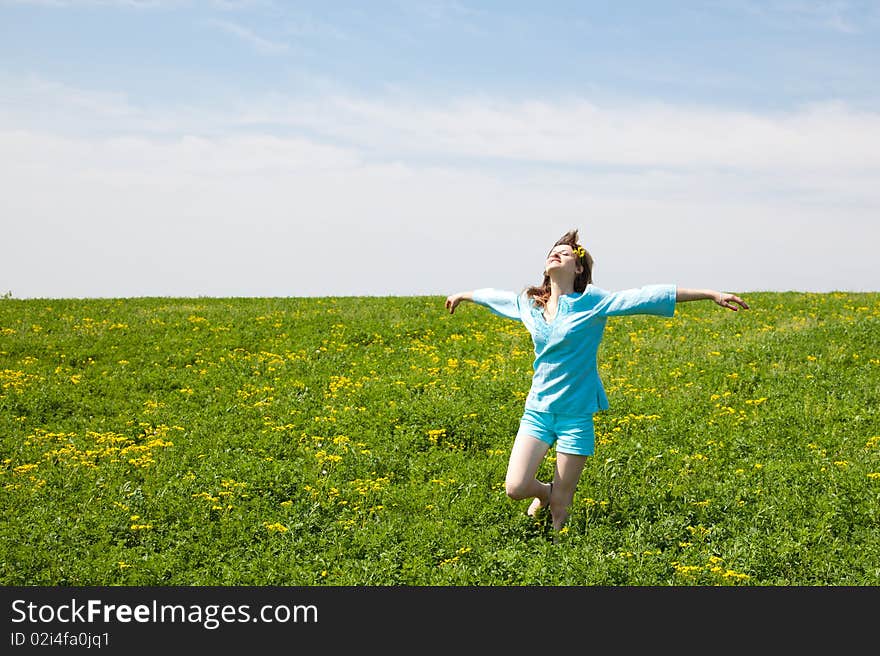 Beautiful young woman enjoying a sunny day of spring in the nature. Beautiful young woman enjoying a sunny day of spring in the nature