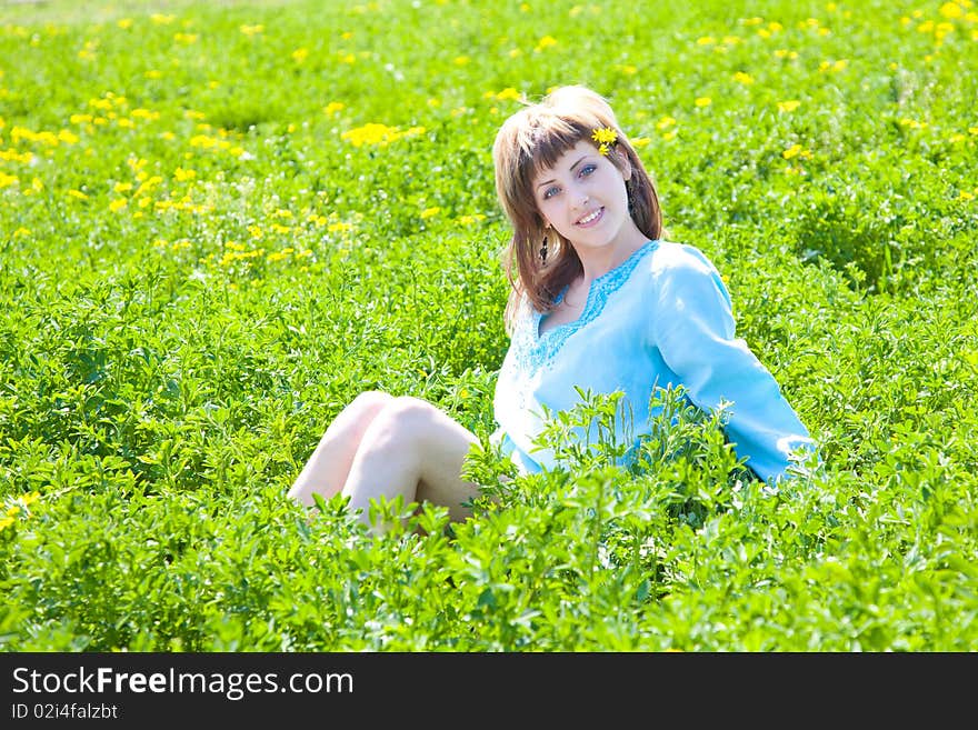 Beautiful young woman enjoying a sunny day of spring in the nature. Beautiful young woman enjoying a sunny day of spring in the nature