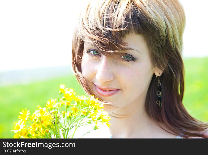 Beautiful young woman enjoying a sunny day of spring in the nature. Beautiful young woman enjoying a sunny day of spring in the nature