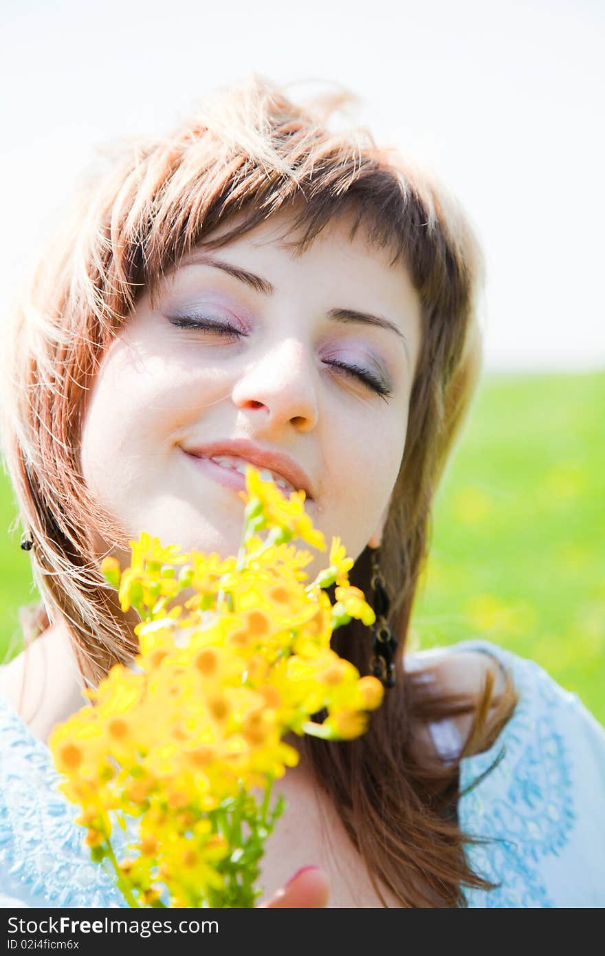 Beautiful young woman enjoying a sunny day of spring in the nature. Beautiful young woman enjoying a sunny day of spring in the nature