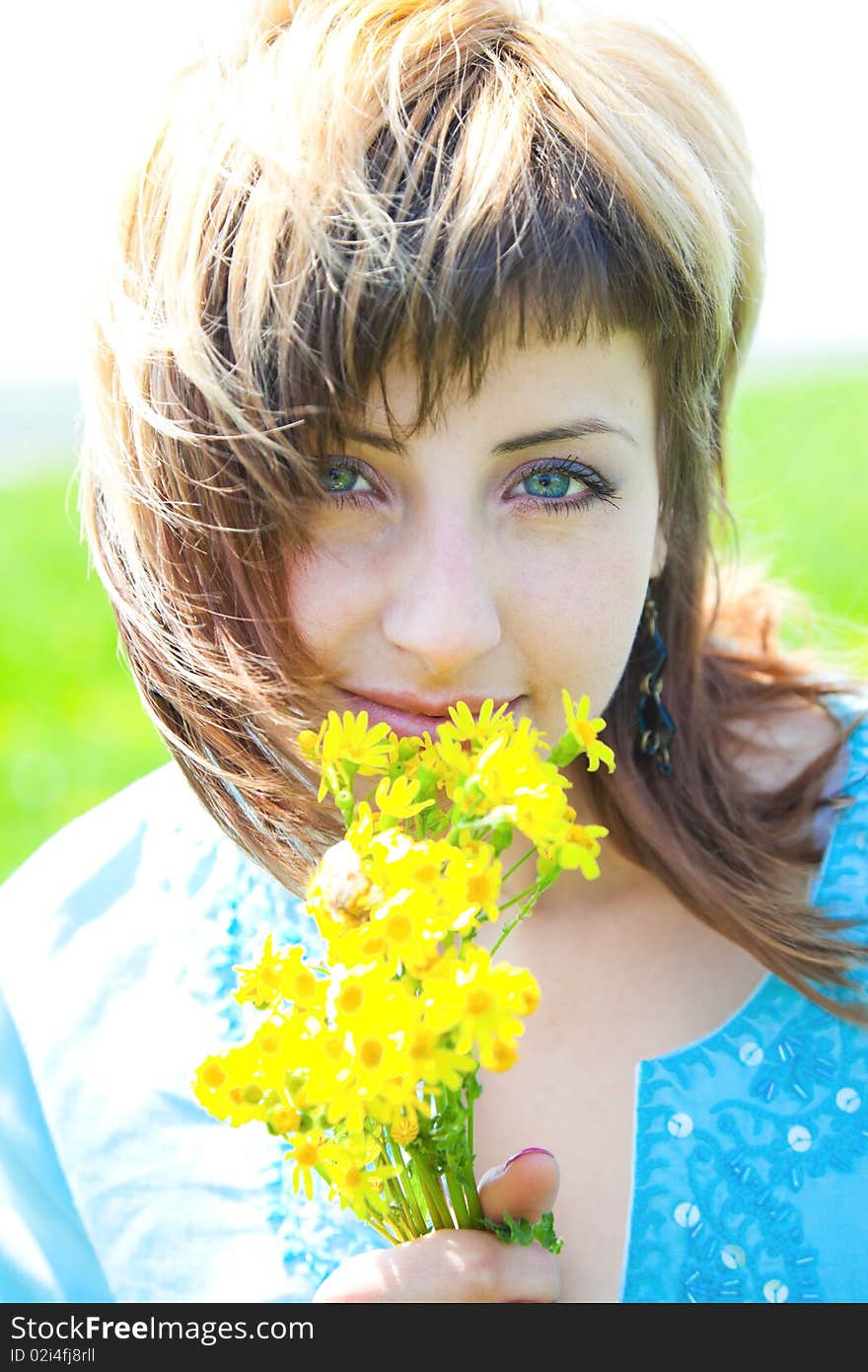 Beautiful young woman enjoying a sunny day of spring in the nature. Beautiful young woman enjoying a sunny day of spring in the nature