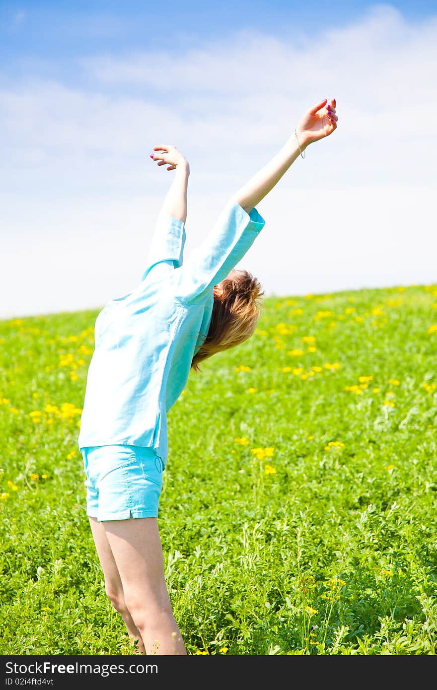 Beautiful young woman enjoying a sunny day of spring in the nature. Beautiful young woman enjoying a sunny day of spring in the nature