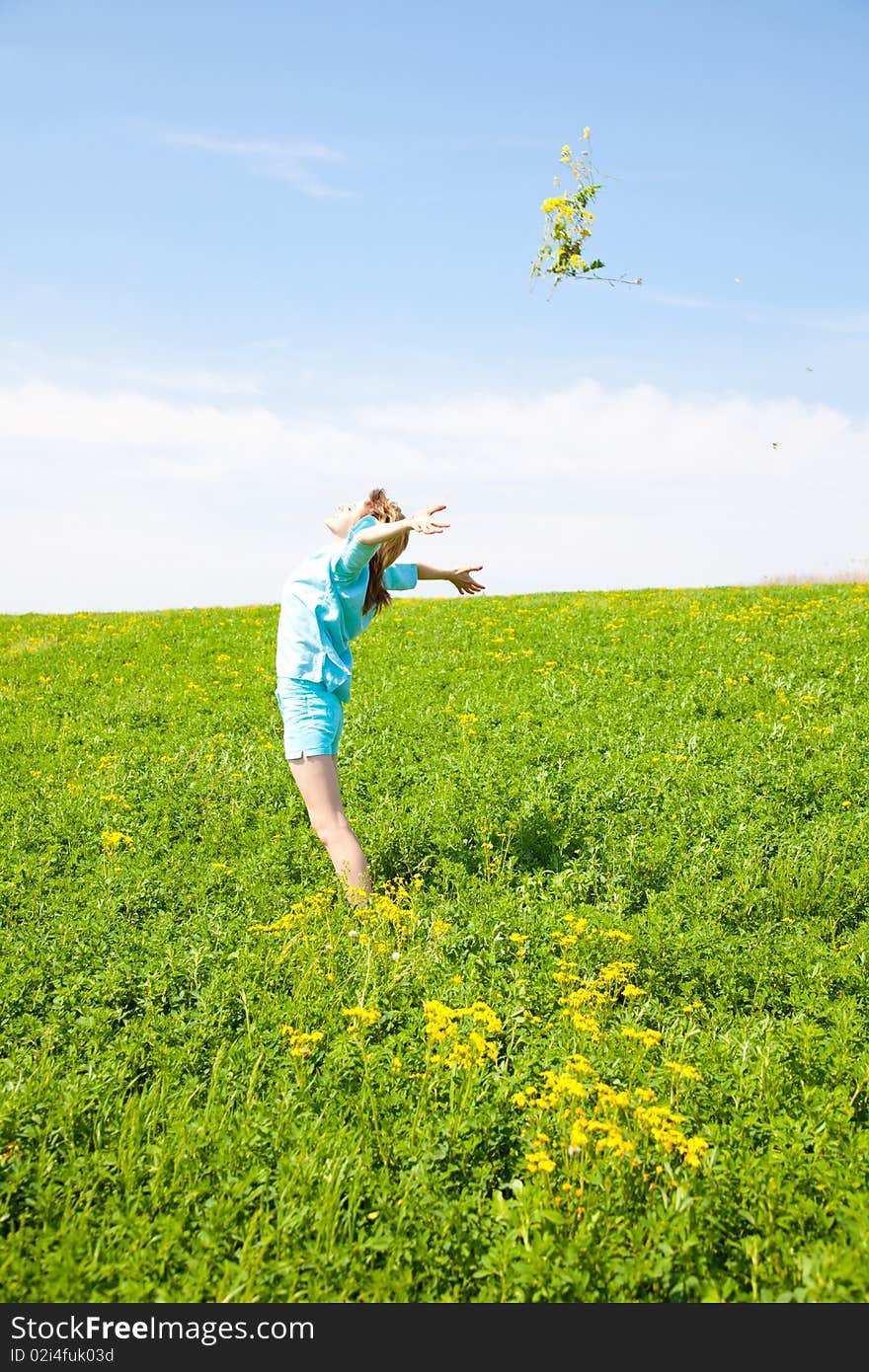 Beautiful young woman enjoying a sunny day of spring in the nature. Beautiful young woman enjoying a sunny day of spring in the nature