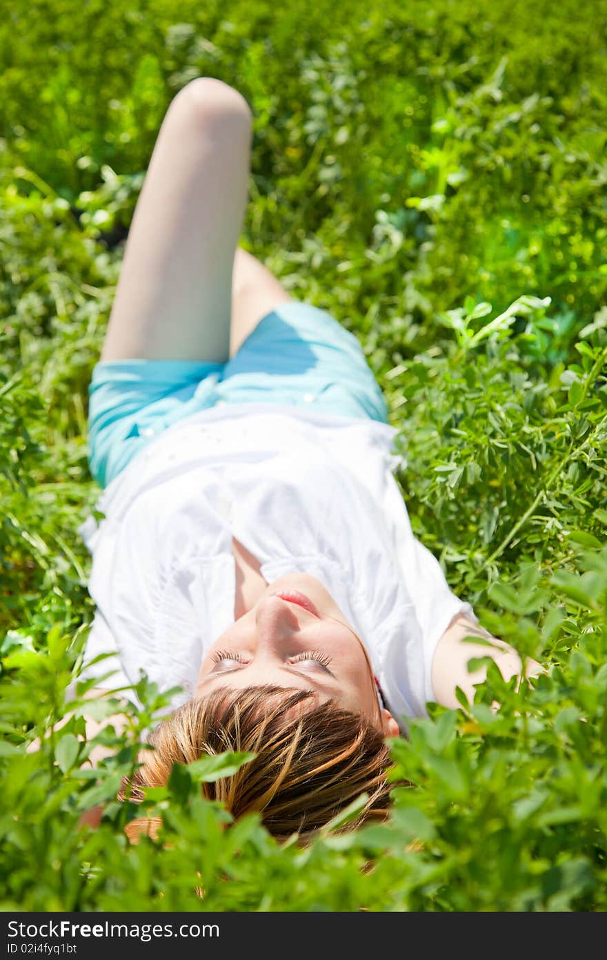 Beautiful young woman enjoying a sunny day of spring in the nature. Beautiful young woman enjoying a sunny day of spring in the nature