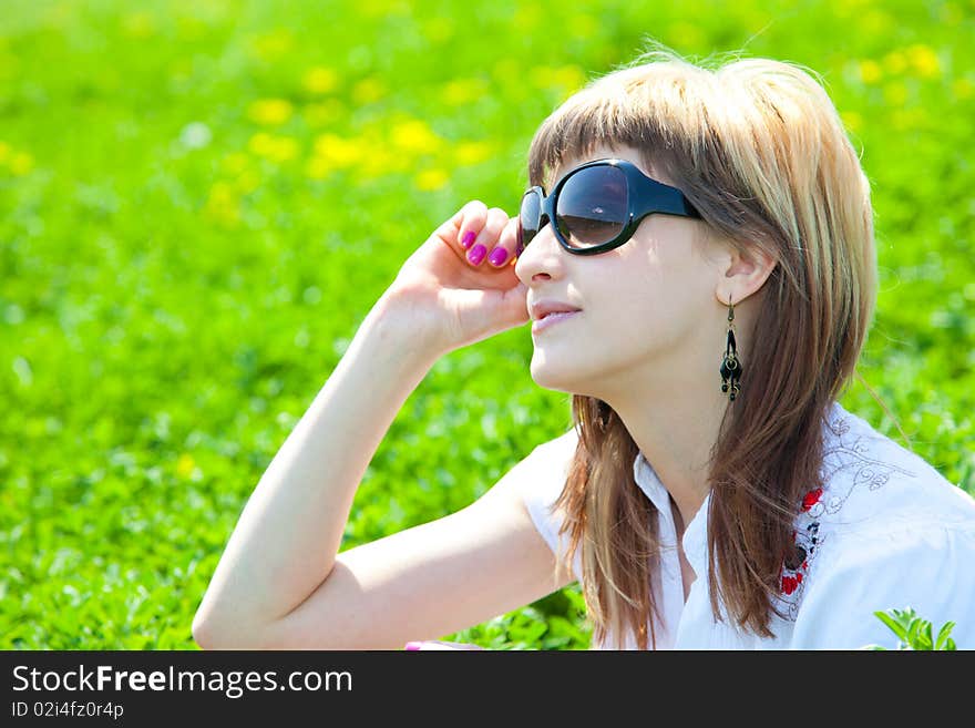 Beautiful young woman enjoying a sunny day of spring in the nature. Beautiful young woman enjoying a sunny day of spring in the nature