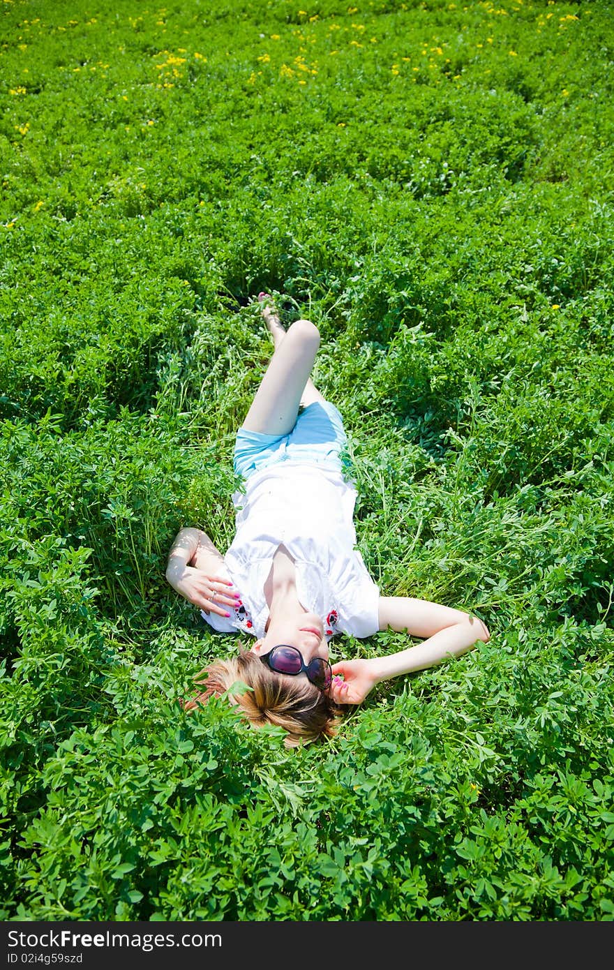 Beautiful young woman enjoying a sunny day of spring in the nature. Beautiful young woman enjoying a sunny day of spring in the nature