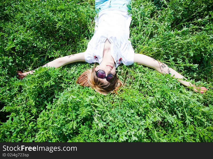 Beautiful young woman enjoying a sunny day of spring in the nature. Beautiful young woman enjoying a sunny day of spring in the nature