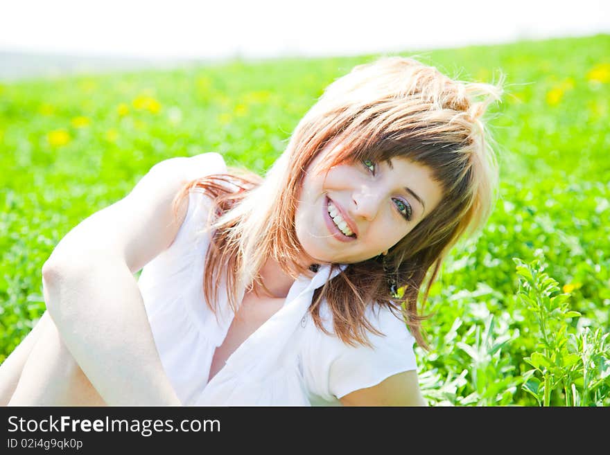 Beautiful young woman enjoying a sunny day of spring in the nature. Beautiful young woman enjoying a sunny day of spring in the nature