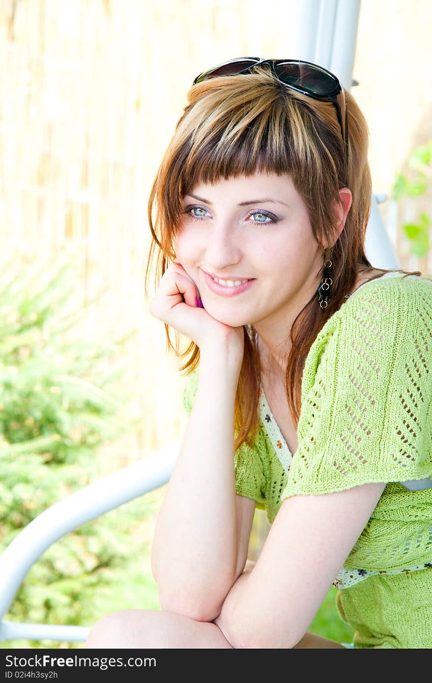 Beautiful young woman relaxing in the shades