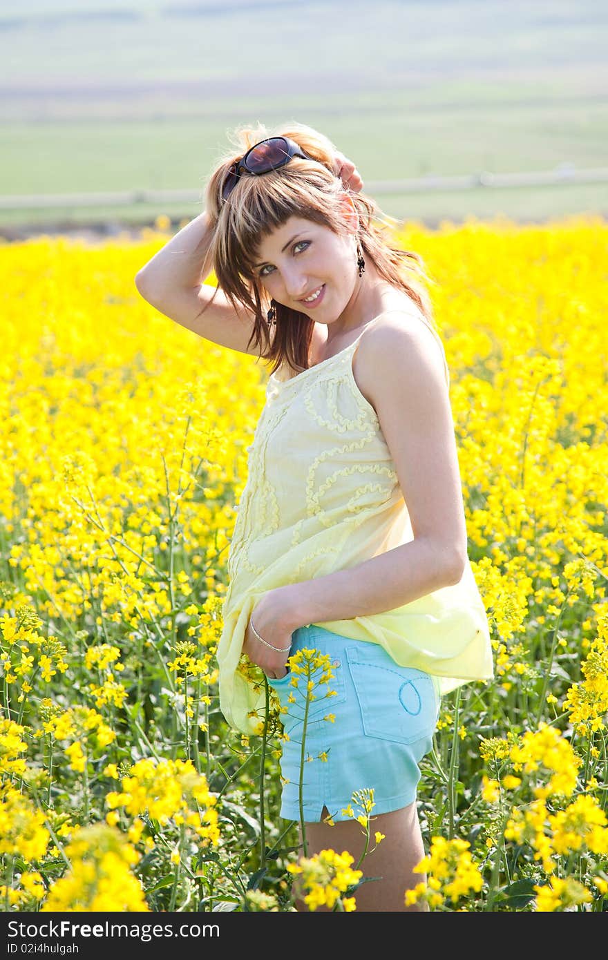 Girl in a rapeseed field