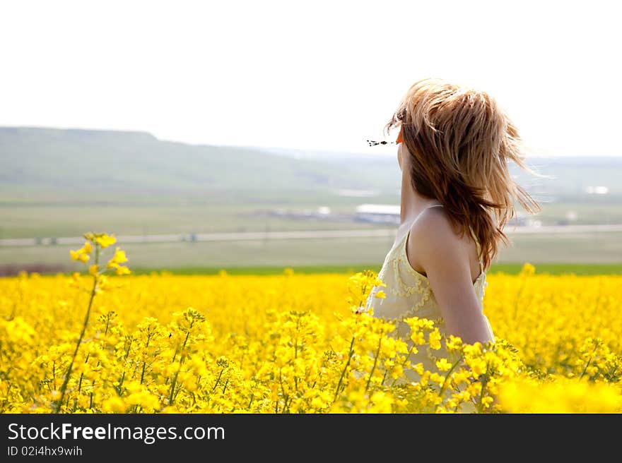 Girl in a rapeseed field