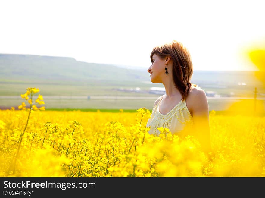 Girl in a rapeseed field