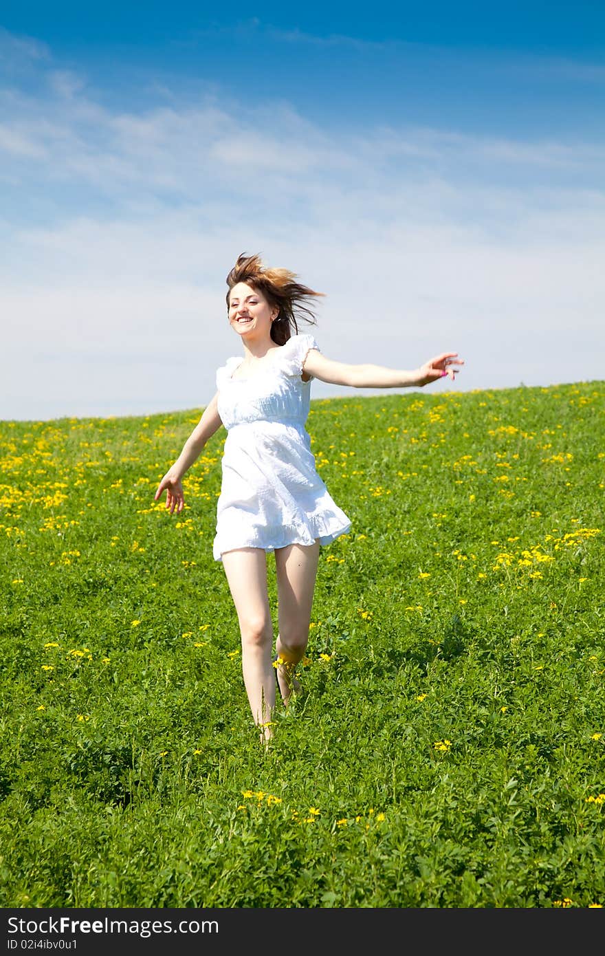 Young woman enjoying the nature in a warm spring day