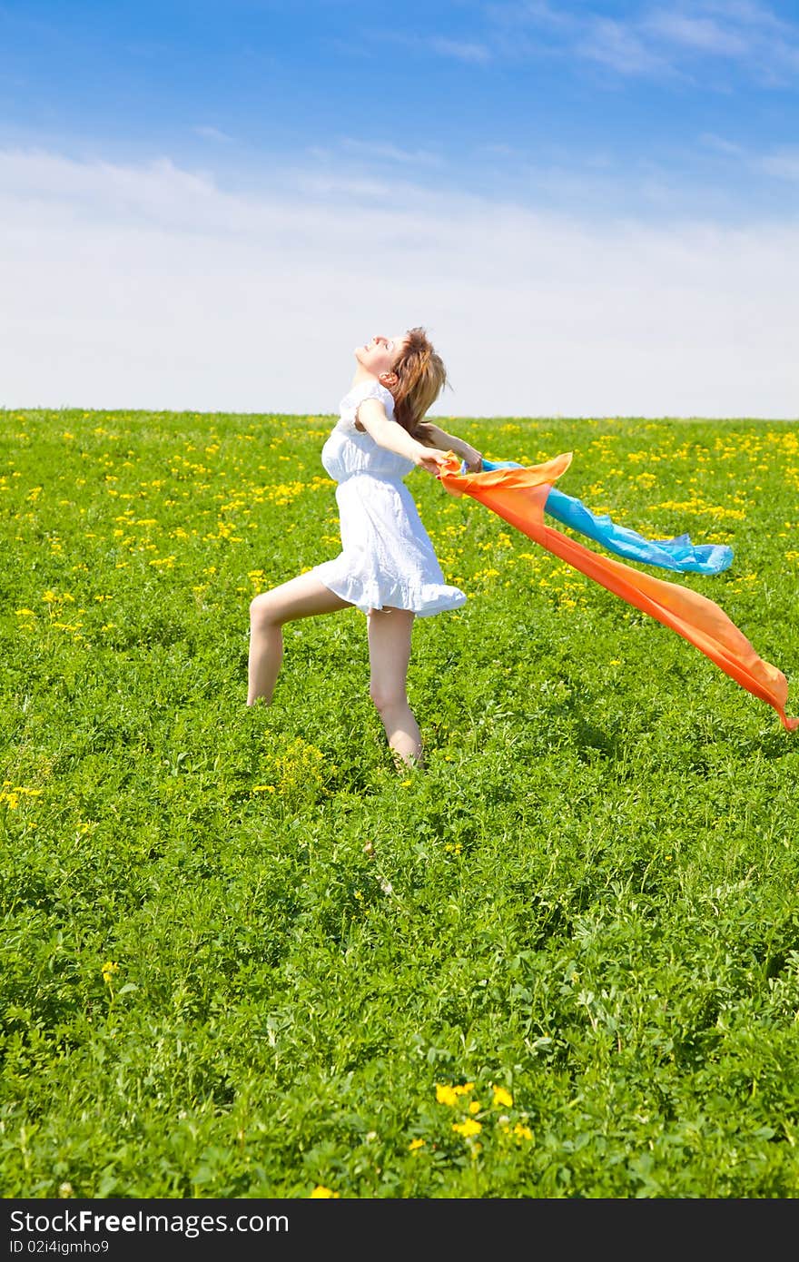 Young woman enjoying the nature in a warm spring day