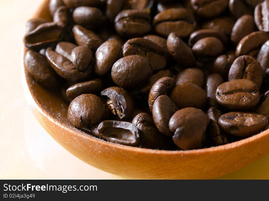 Fresh roasted,coffee beans in the spoon,close up