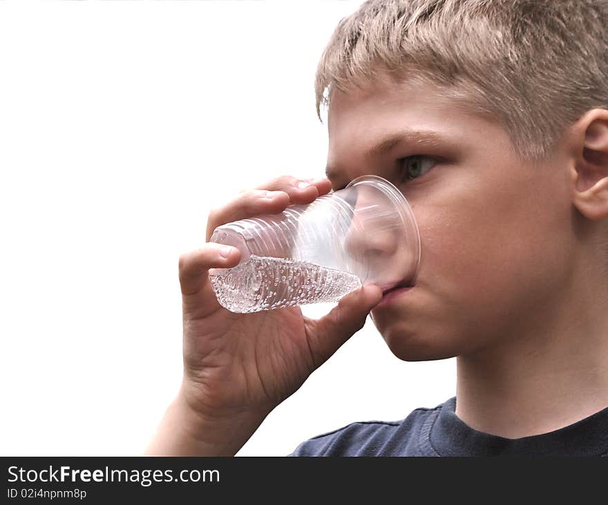 Water.Teenager drinks from can.