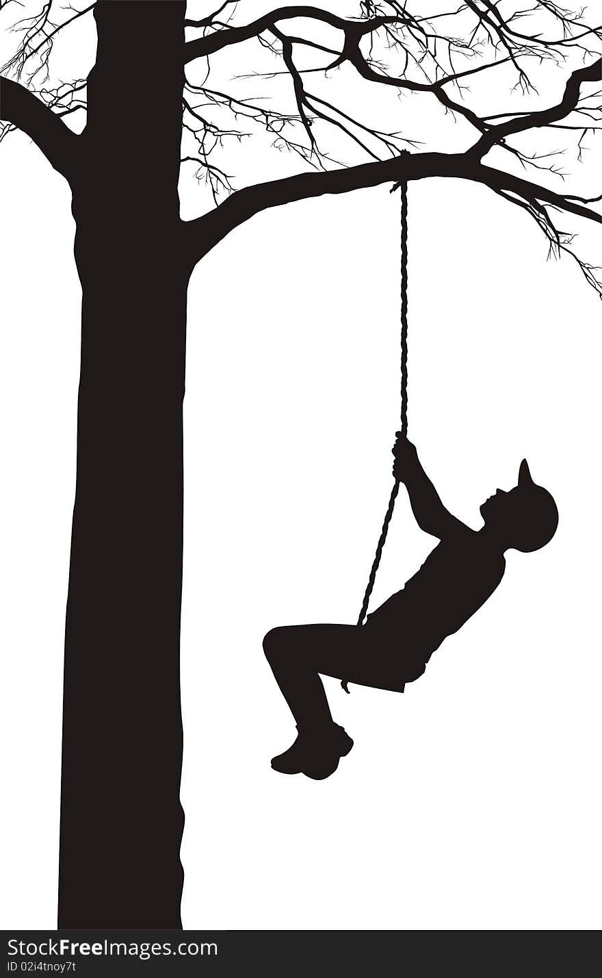 A boy swings on a tree