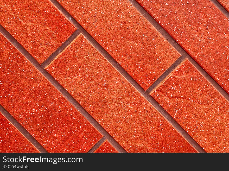 Dark red brick tile wall closeup view. Dark red brick tile wall closeup view.