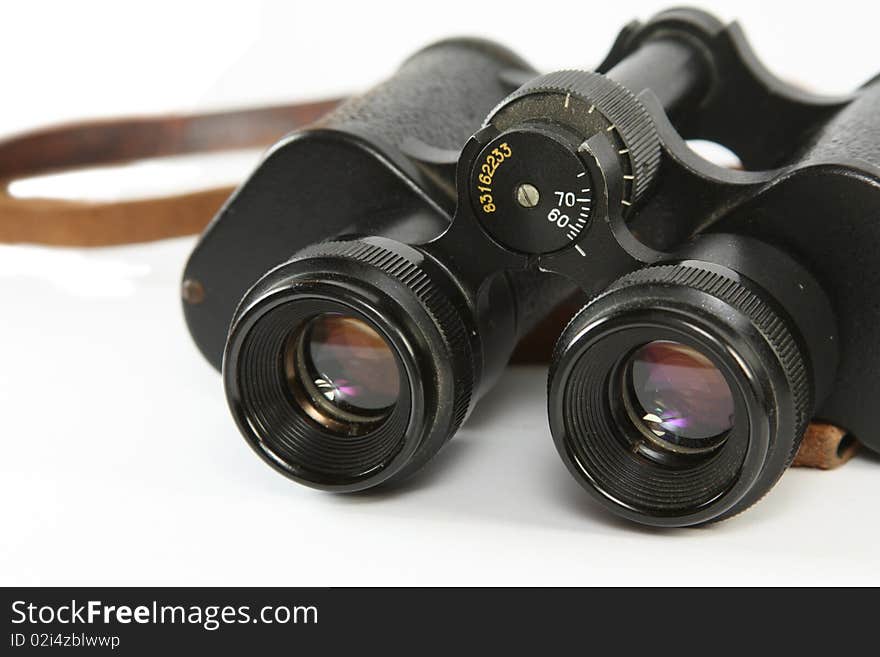 Old russian binoculars isolated on white