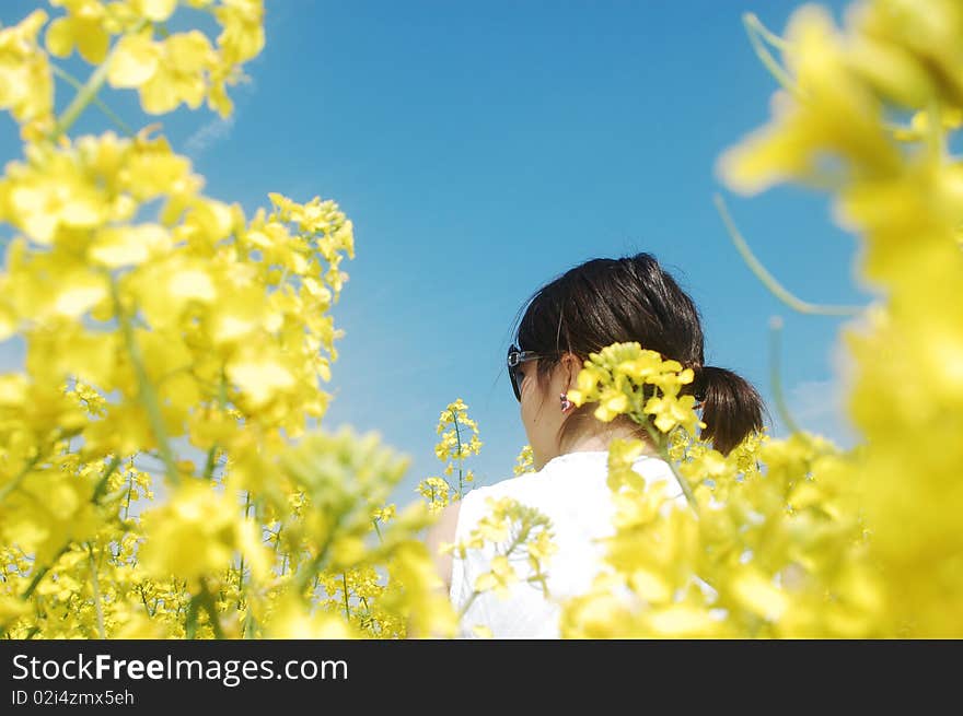 Young girl enjoying a sunny day on canola field. Young girl enjoying a sunny day on canola field