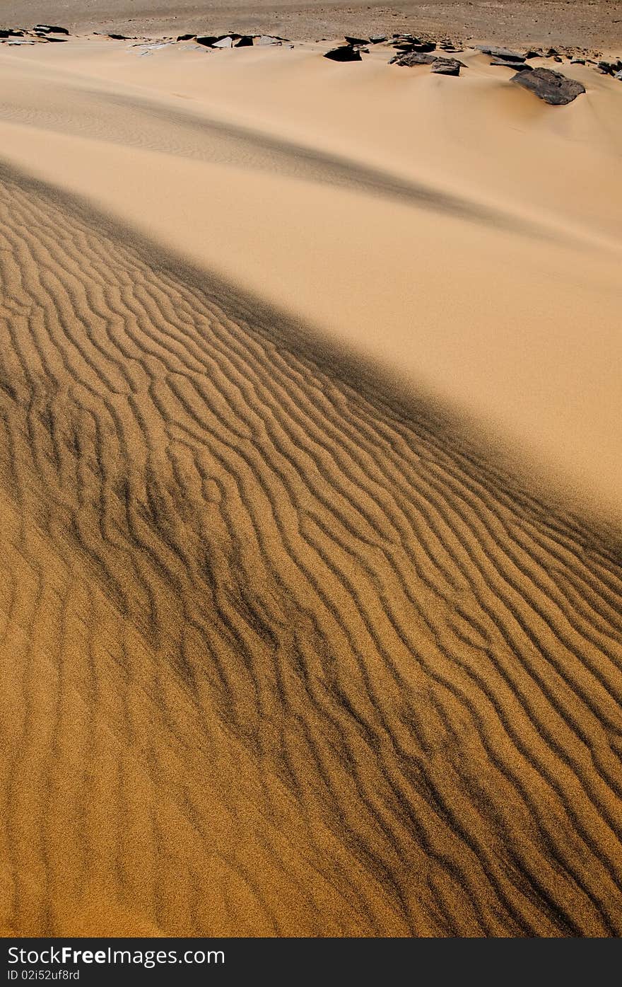 Light games on dune at sunset. Light games on dune at sunset