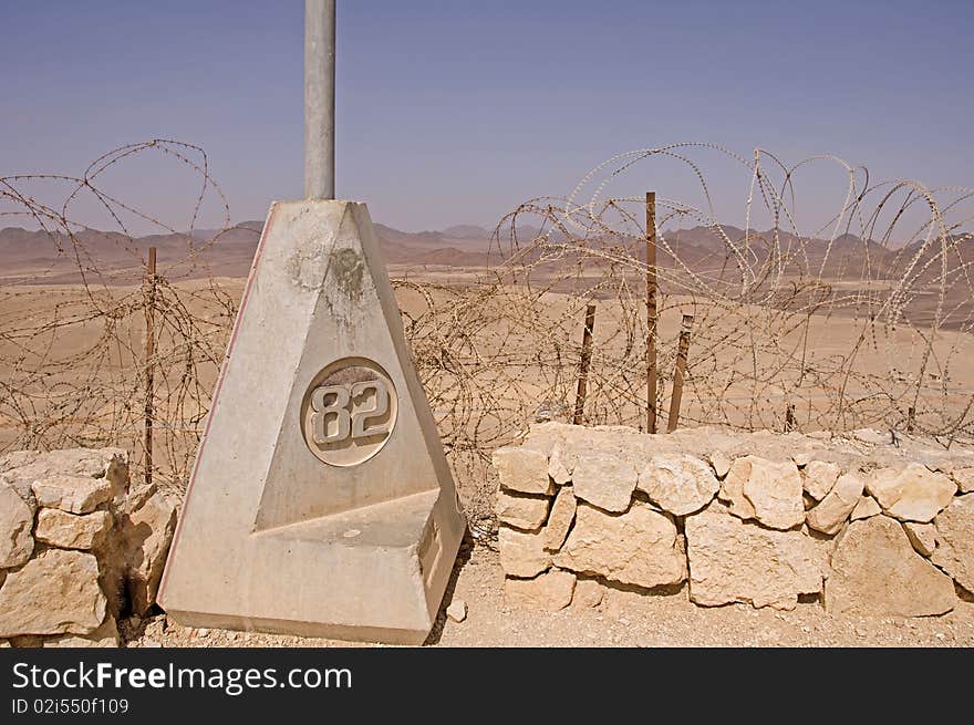 Heavy stone landmark numbered 82, on the frontier line. Heavy stone landmark numbered 82, on the frontier line.