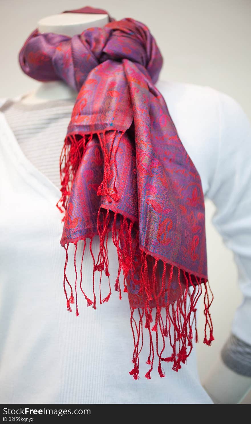 Foulard with red tones on a mannequin