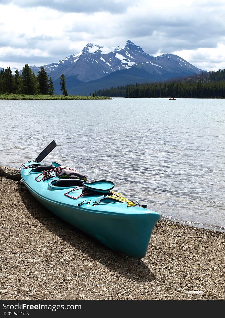 Canada canoe kayak lakeside mountain view and beach. Canada canoe kayak lakeside mountain view and beach