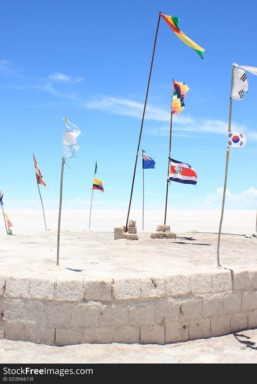 Flags of Different Nations on White Plain. Taken on the Salar de Uyuni (or Uyuni Salt Flats) in Bolivia.