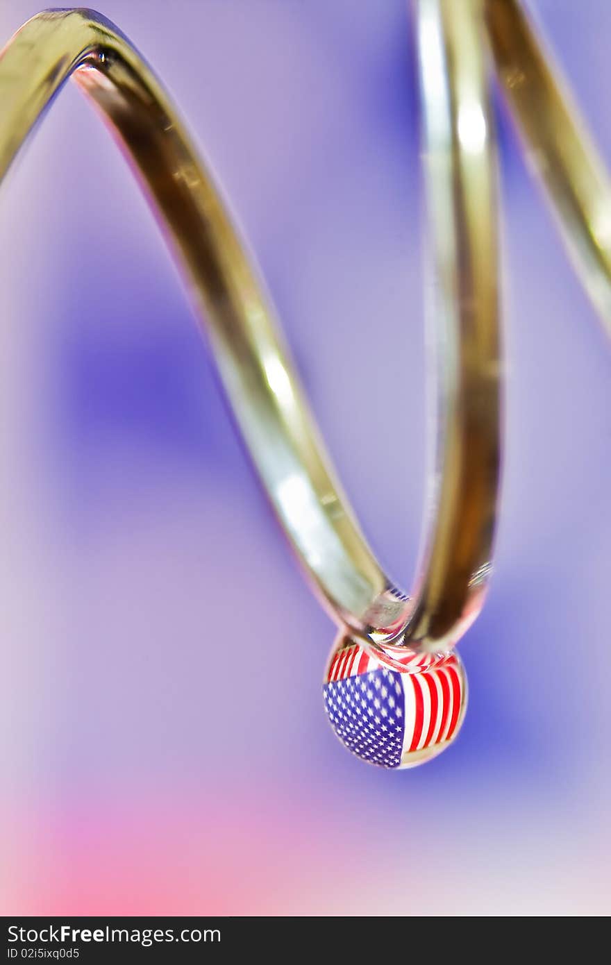 American Flag reflected in a water drop.