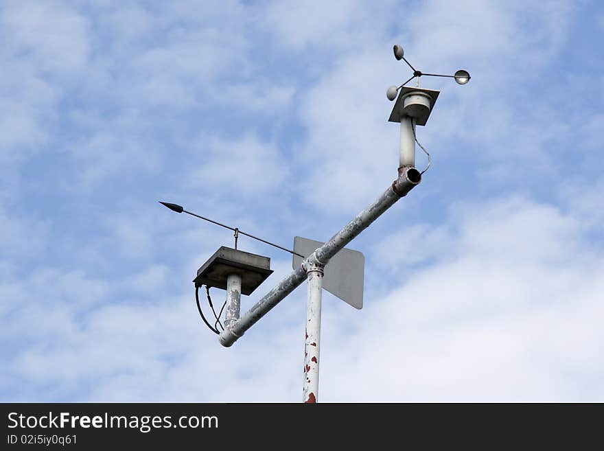 Weather instruments against a blue