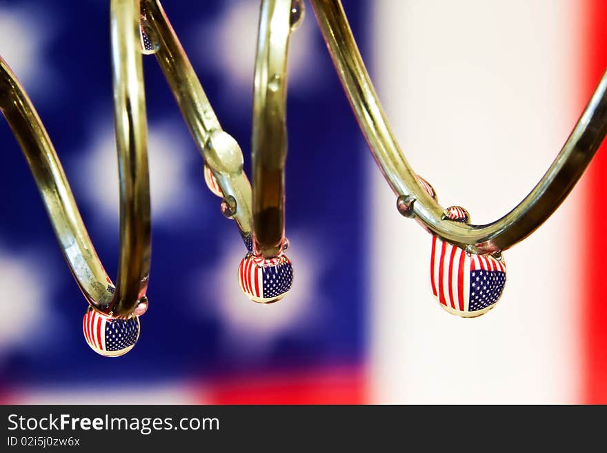 American Flag reflected in water droplets.