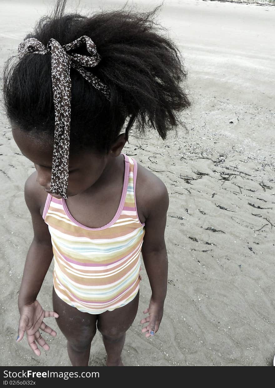 An abstract photo of a young black girl on the beach. An abstract photo of a young black girl on the beach