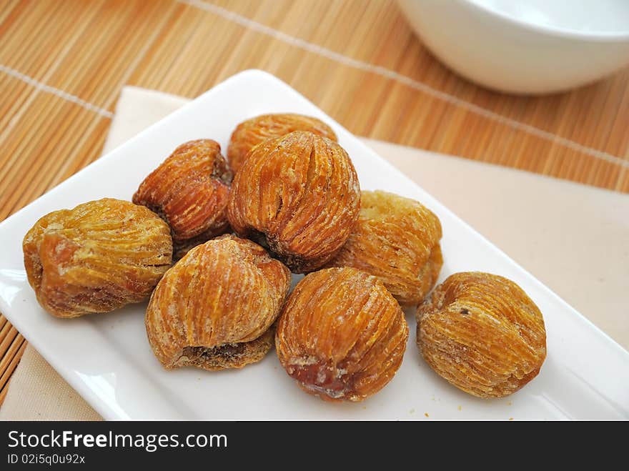 Dried honey dates on plate