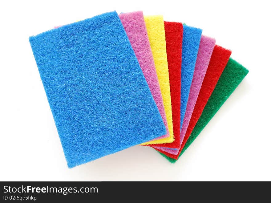 Colorful sponges used for cleaning and washing isolated on white background. For cleaning equipment and supplies. Colorful sponges used for cleaning and washing isolated on white background. For cleaning equipment and supplies.