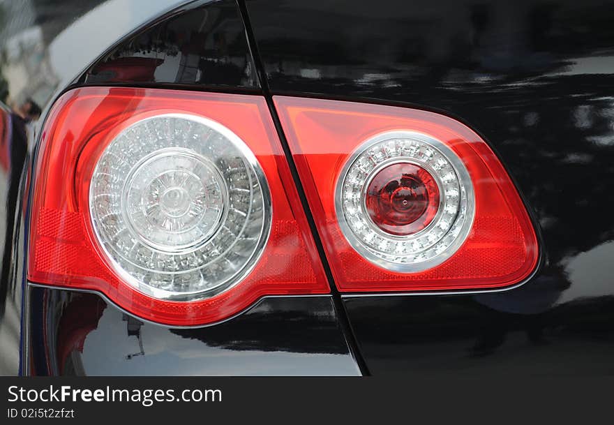 The glass taillight of a modern luxury car.