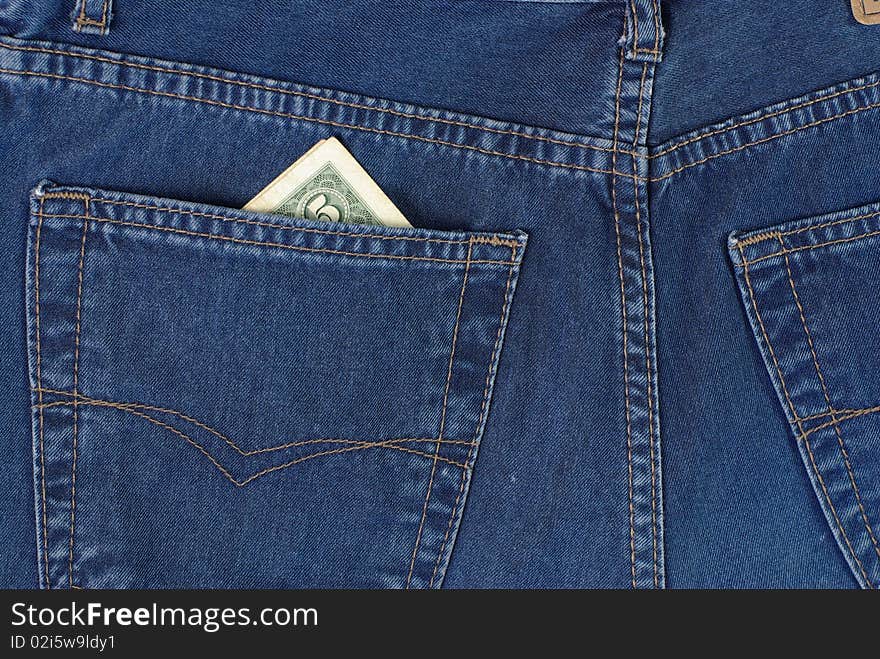 Dollars in blue jeans pocket