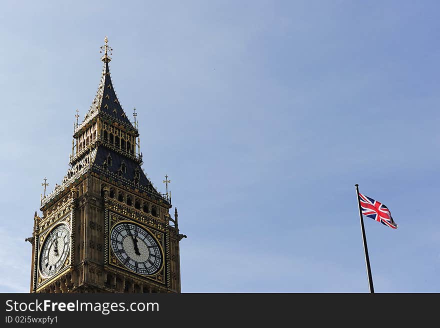 Big Ben and England Flag on Blue Sky