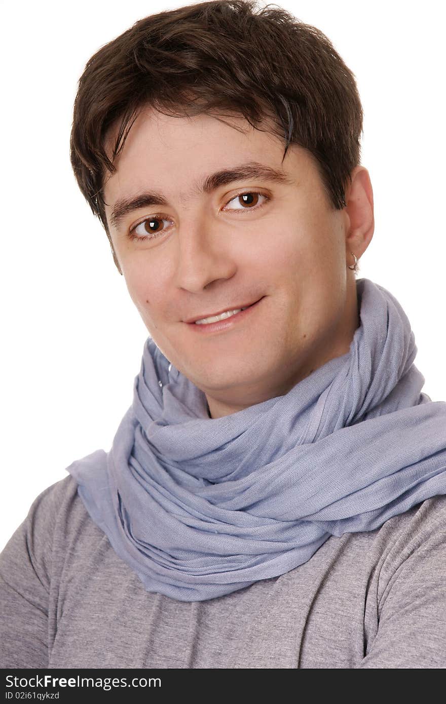 Portrait of young attractive smiling man in blue scarf on white background. Portrait of young attractive smiling man in blue scarf on white background