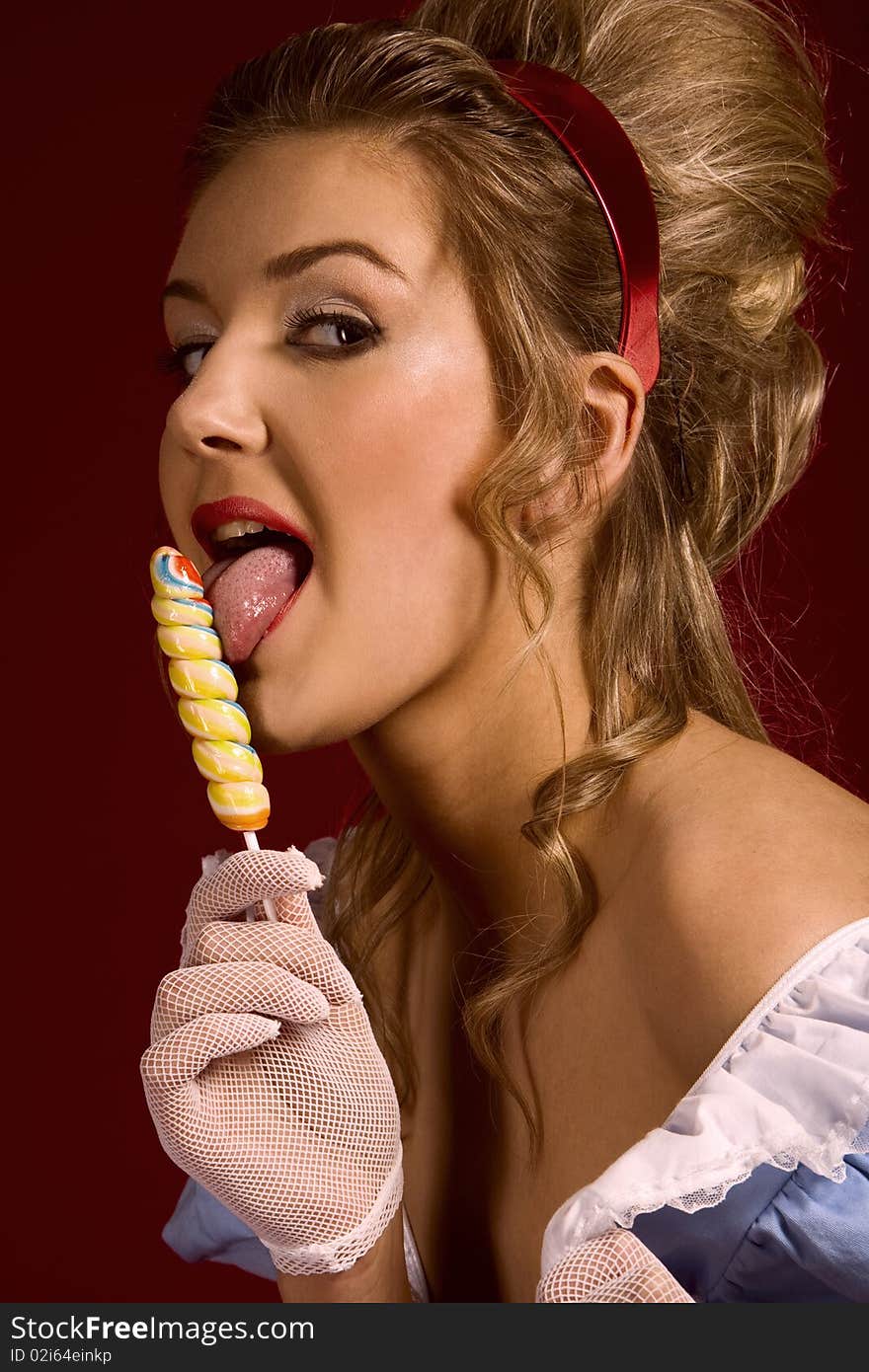 Lollipop. Pin up studio woman's portrait