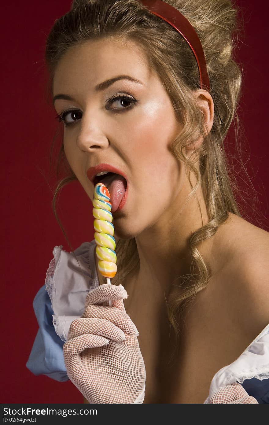 Lollipop. Pin up studio woman's portrait