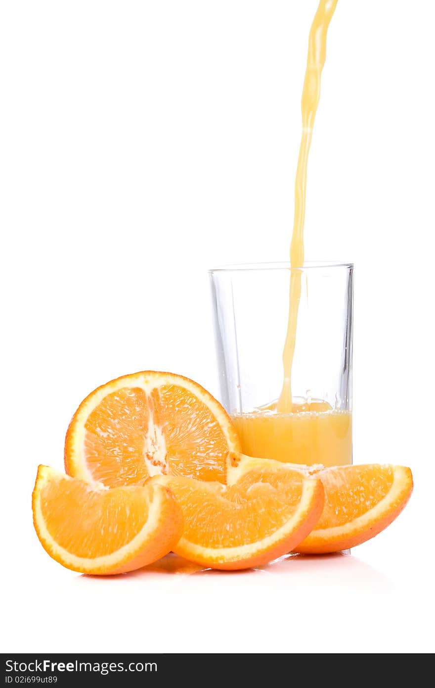 Orange slices and half juice in glass