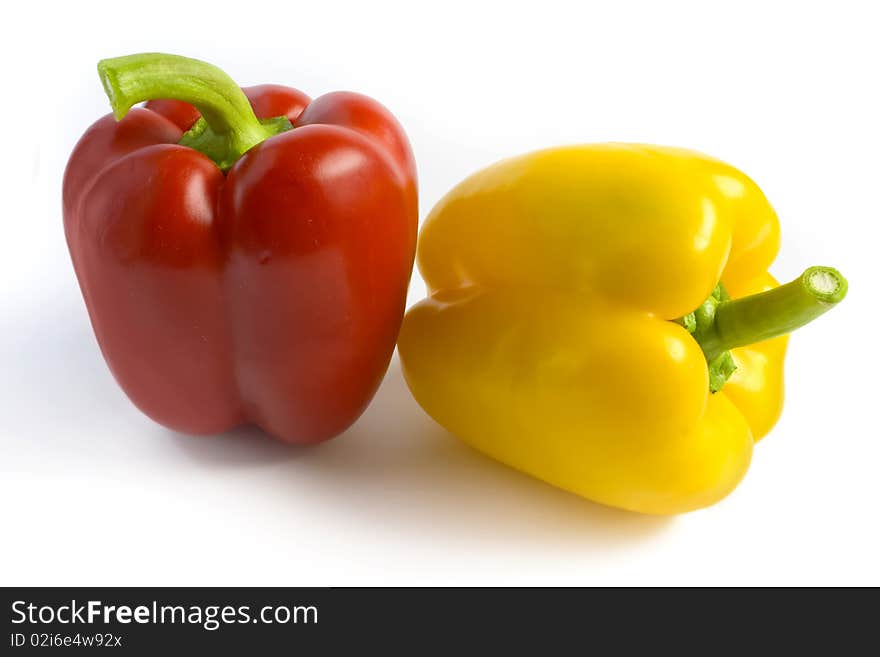 Red and yellow pepper on a white background. A photo close up