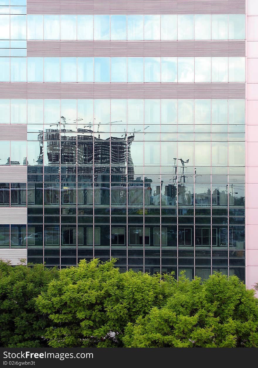 Reflection of unfinished building on