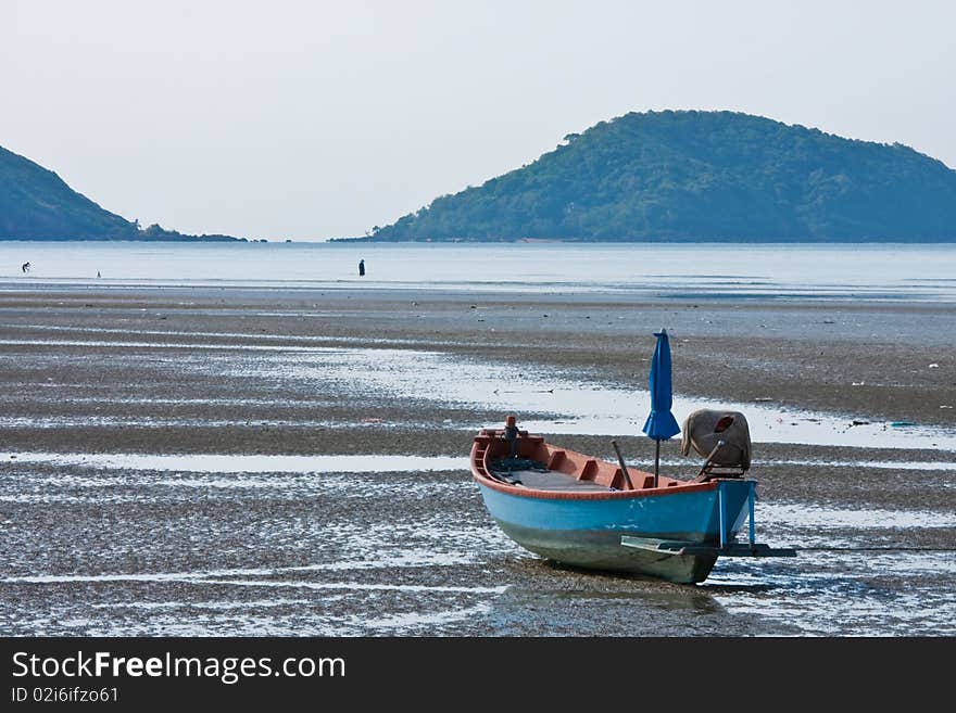 Blue boat of fisherman on beach